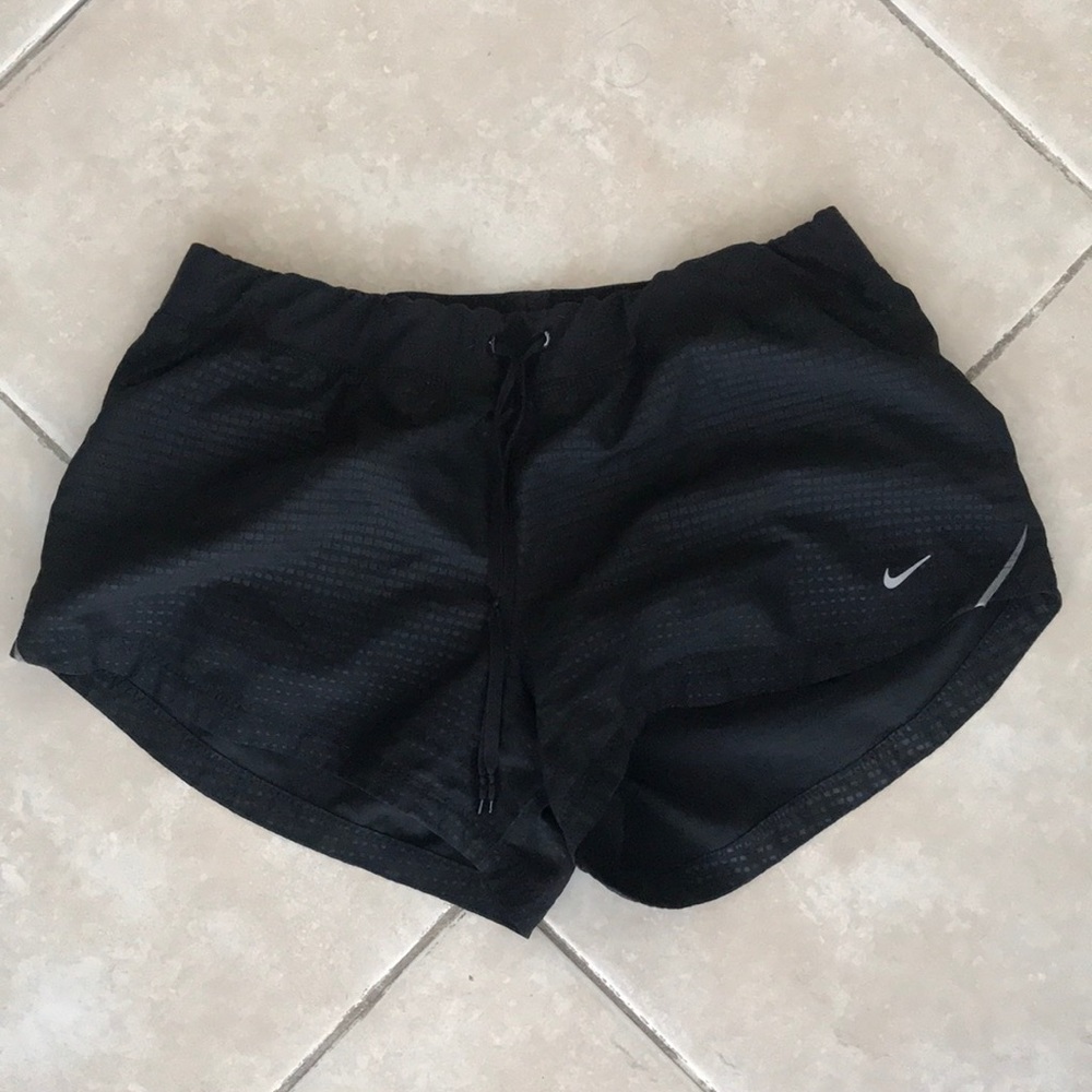 Black Nike running shorts